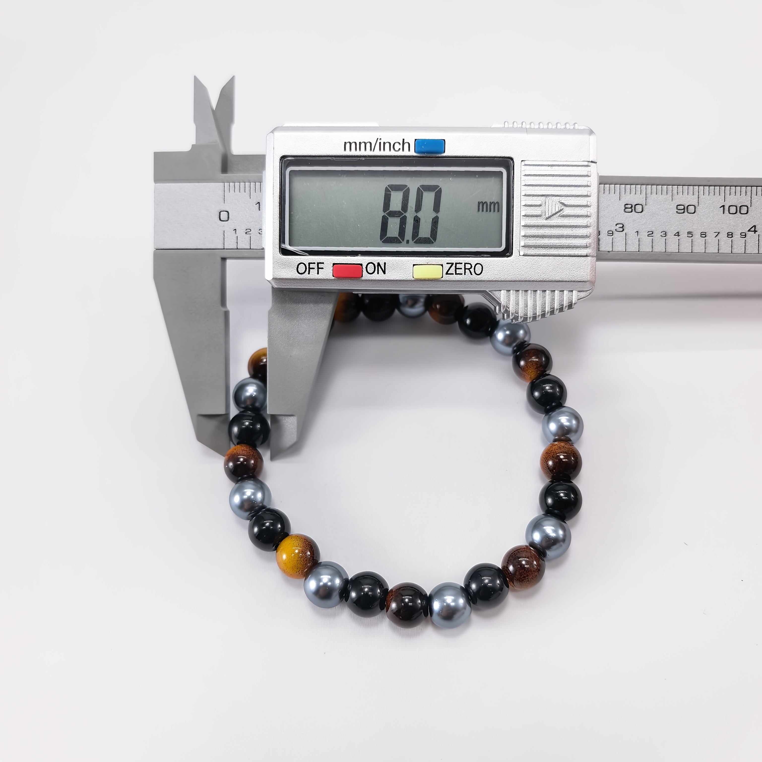 a bracelet made three types stones tigers eye obsidian black